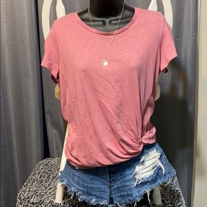 Women’s light pink top.